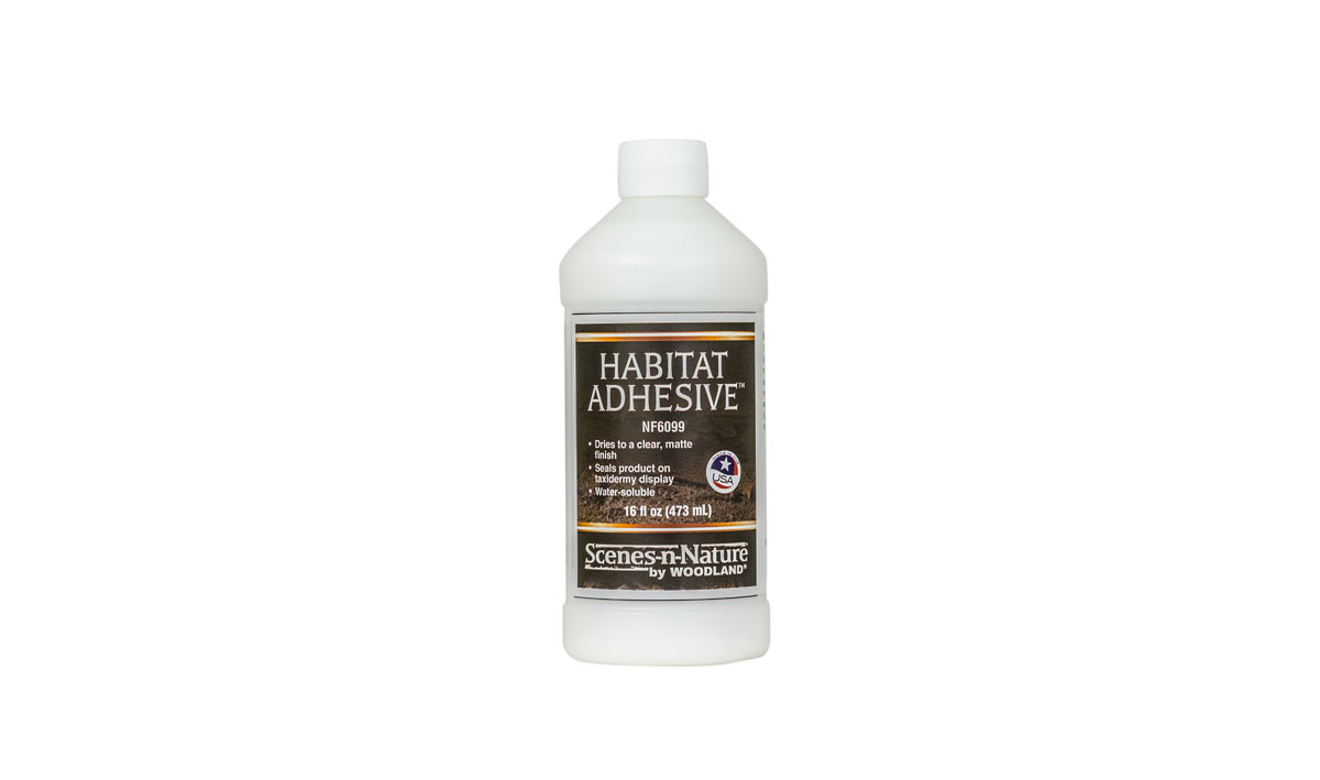 Habitat Adhesive<sup>™</sup>  - Habitat Adhesive&trade; is a ready-to-use spray or brush-on adhesive specially formulated to glue and seal Static Fibers&trade;, Velvet Fibers and other materials to a taxidermy display